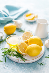 Lemon, rosemary, garlic and olive oil. Ingredients for mediterranean cuisine cooking