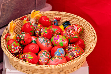 Easter eggs color vibrant, spring Orthodox holiday. Colorful decorated eggs in a wooden basket