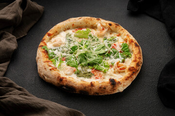 Pizza with shrimp, mozzarella cheese, green salad leaves