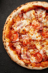 Pizza with bell peppers, onions, cheese and sauce