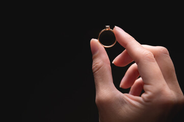 ring is held with the fingers, demonstrating the diameter of the ring and its type. jewelry in a...