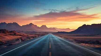 Foto op Canvas  a long road in the middle of a desert with a mountain range in the background and a sunset in the middle of the road in the middle of the middle of the picture. © Olga