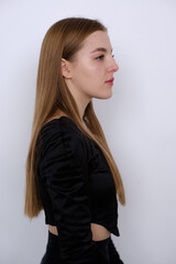 Fototapeta premium Young girl in black t-shirt model snap right look close up on white background