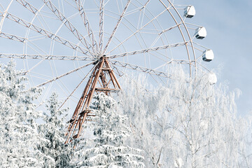The Ferris wheel in winter winter frosty day. Embankment of the Ob river in winter in Novosibirsk frost day -40 degrees Celsius