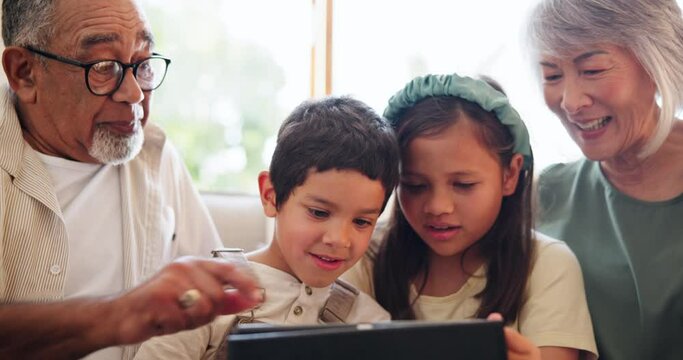Grandparents, smile and kids on tablet in home living room, learning or social media. Technology, grandma and grandpa with children typing on app, online education or thumbs up for interracial family