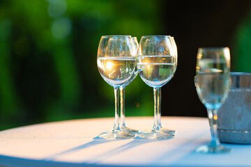Champagne glasses on the buffet table. Table setting for a buffet at a party. 