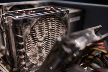 Close-up of a PC cooling system, a dirty radiator from a computer
