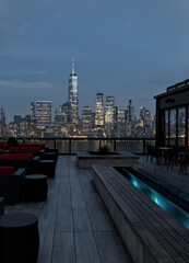 rooftop bar restaurant with views of downtown manhattan skyline (seats and bench) new york city...
