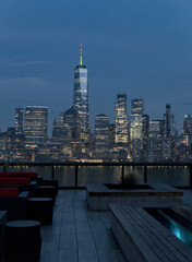 rooftop bar restaurant with views of downtown manhattan skyline (seats and bench) new york city...