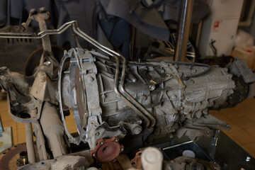 Closeup disassembled car automatic transmission gear part on workbench at garage or repair factory...