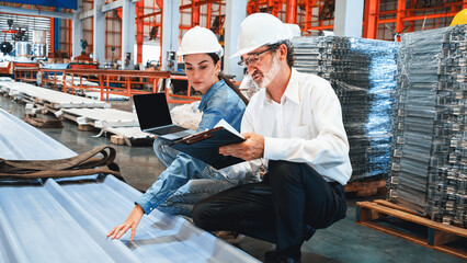 Metalwork manufacturing factory manager inspect newly manufactured metal or steel sheets and frame...