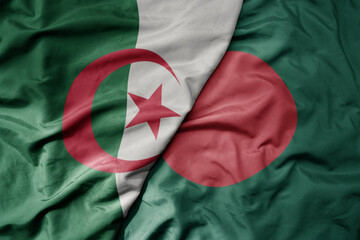 big waving national colorful flag of bangladesh and national flag of algeria .