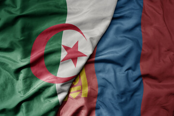 big waving national colorful flag of mongolia and national flag of algeria .