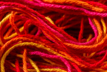 Close-up colorful wool for knitting and weaving, multi colored tangled yarn