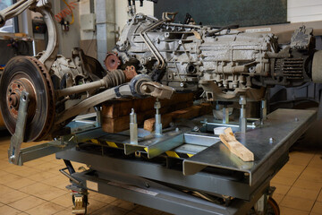 Closeup disassembled car automatic transmission gear part on workbench at garage or repair factory...
