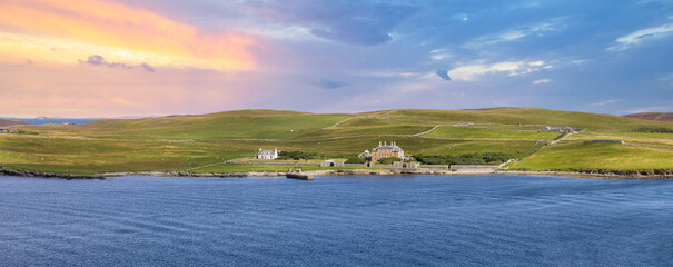 Scotland Shetland scenery in England with cliffs, ocean views and green pastures.