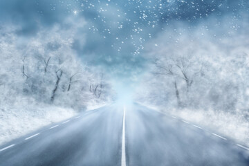 Fototapeta na wymiar a snowstorm in winter road, snow-covered, dramatic landscape, safety concept on a slippery road