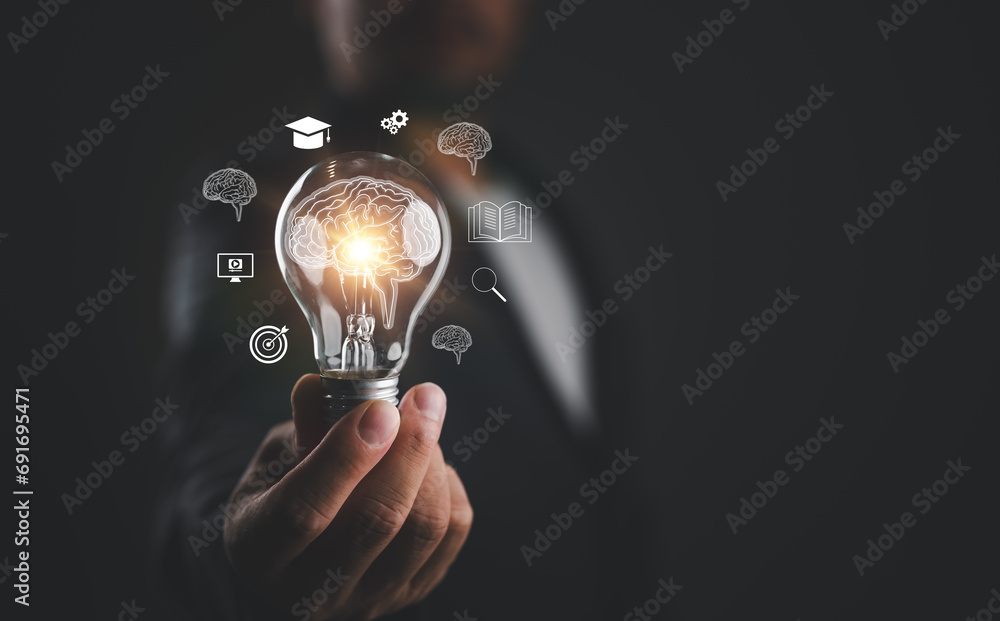 Wall mural e-learning graduate certificate program concept. man holding lightbulb showing education icon, inter - Wall murals