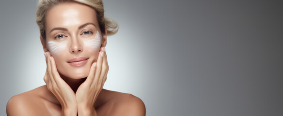 The face of an older woman, adorned with cream, speaks volumes about the essential role of skincare in graceful aging