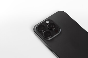 black smartphone with white wireless headphones, Iphone 15 pro max Black Titanium