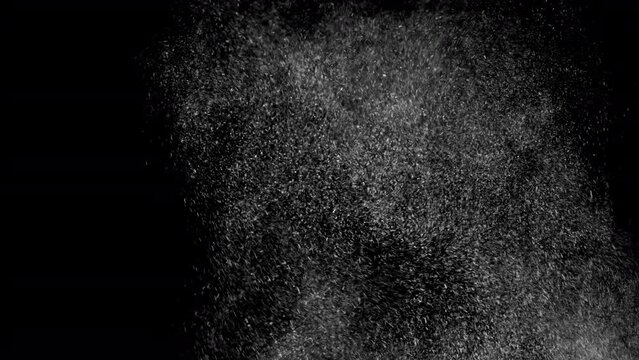 Huge falling VFX dust particles Floating On Black Background. Dynamic Dust Particles Randomly Float In Space. Shimmering Glittering Dust Particles