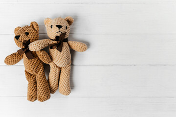 teddy bears close up on the white wooden background