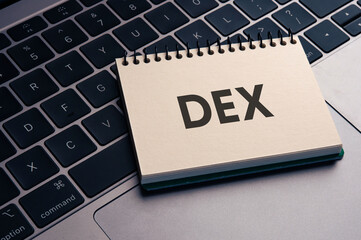 There is notebook with the word DEX. It is an abbreviation for Decentralized Exchange as...