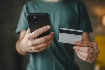 teenager young man at home use credit card shopping online e-banking