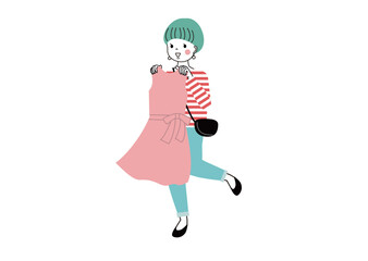 ショッピング　洋服を体にあてている女性