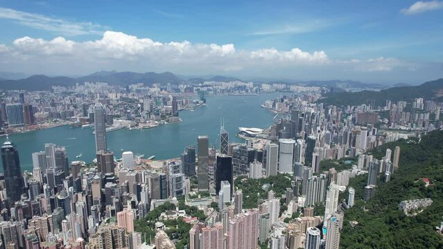 City Aerial in The Peak Central Admiralty Wan Chai Causeway Bay Hong Kong Island and Kowloon Tsim Sea Tsui ,4K drone shot of the residential and commercial area within financial business