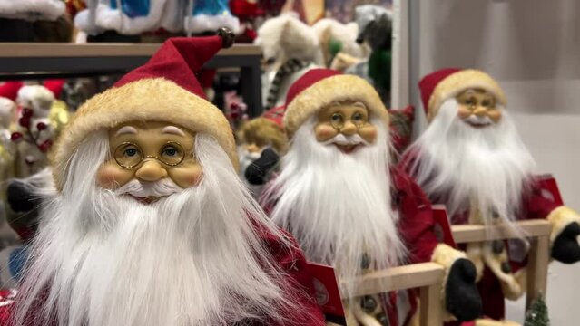 Santa Claus figurines are sold at the store before Christmas
