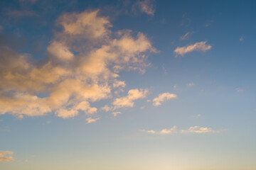 Naklejka na ściany i meble Photo background, sky with clouds at sunset.