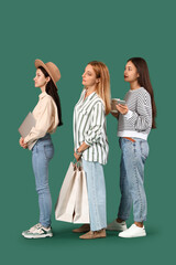 Women waiting in line on green background