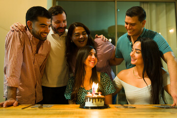 Young woman celebrating her birthday with her friends