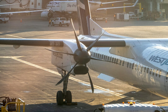 Alberta, Calgary, Canada. Dec 11, 2023. A gas turbine engine to turn a propeller, which generates thrust and propels a Westjet airplane through the air.