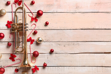 Composition with trumpet and beautiful Christmas decorations on white wooden background © Pixel-Shot