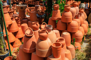 Clay products from pottery production. Background with selective focus and copy space