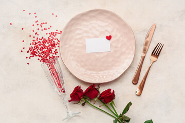 Blank card and beautiful table setting with red roses on white background. Valentine's Day...