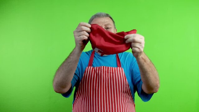 Senior chef throws away his hat and puts crown.