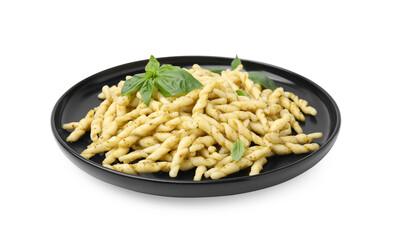 Plate of delicious trofie pasta with pesto sauce and basil leaves isolated on white