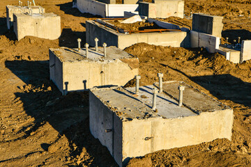 Concrete footings with anchor bolts ready for framing of new commercial building. © Tom Williams