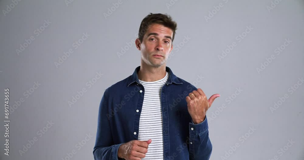 Poster Man, pointing and face for confused in studio for decision, choice and options by gray background. Person, portrait and why in emoji with questions in problem solving, planning and doubt in mockup