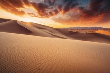 Fototapeta na wymiar Dramatic sunset over a desert landscape with orange sky.