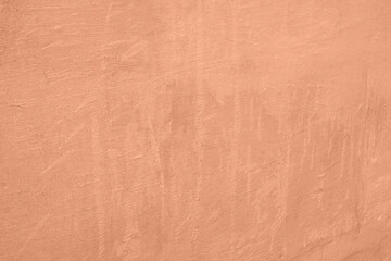 Peach Fuzz toned colour grunge decorative wall background. Art rough stylized texture banner trendy color 2024. Grunge Peach Fuzz color texture