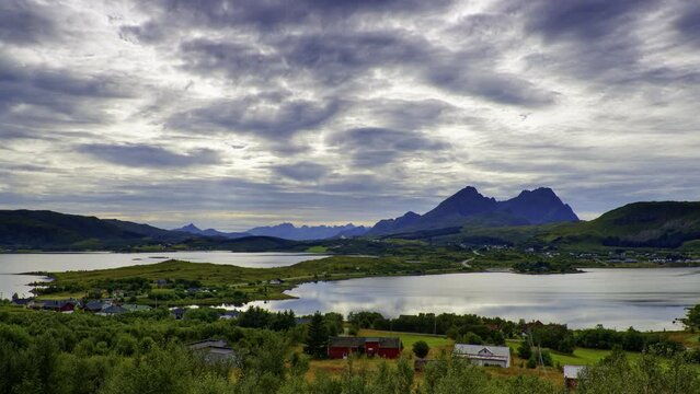 A cloudy day. Late August panoramic view from Borg, the place right in the middle of Lofoten, Northern Norway. On the left hand side of the road , fresh water lake; on the right hand side seawater.