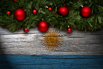 Christmas background made with garlands on a argentina flag background. Christmas greeting from...
