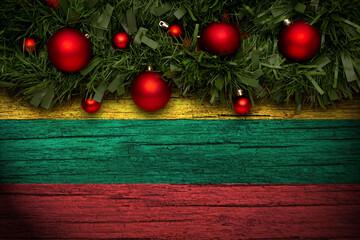 Christmas background made with garlands on a lithuania flag background. Christmas greeting from lithuania. - obrazy, fototapety, plakaty