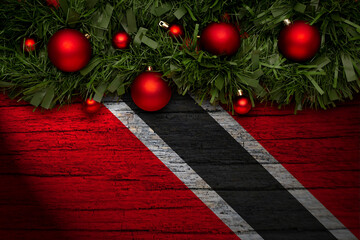 Christmas background made with garlands on a trinidad flag background. Christmas greeting from...