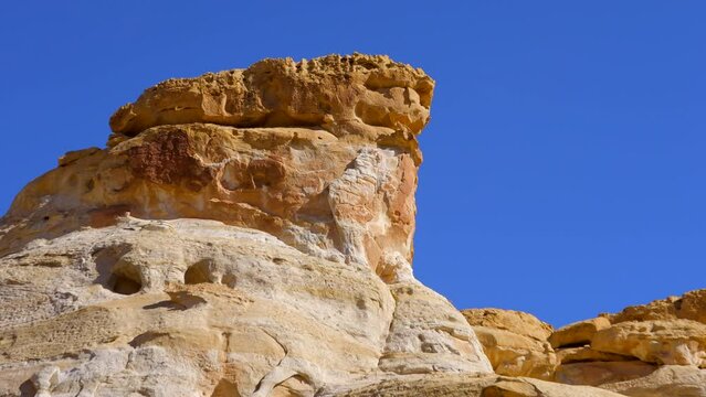 Establishing shot of mountain trail with red rocks in Hickman Natural Bridge Trail, Capital Reef National Park, Utah, North America. ProRes 422 HQ.