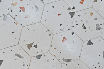 Hexagonal tile with terrazzo pattern